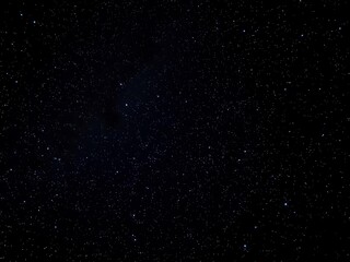 Fototapeta premium Starry night sky with bright sparkling stars on deep black background, galaxy, milky way, sparkling