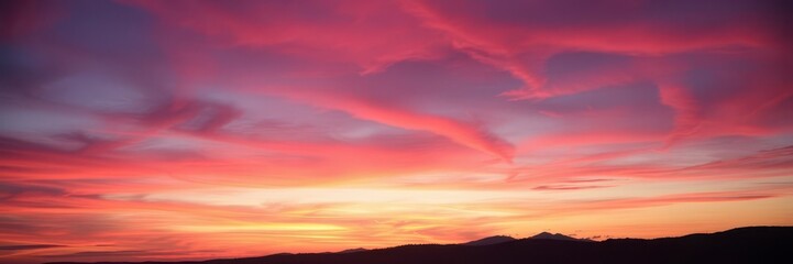 Fototapeta premium Vibrant orange and pink hues paint the abstract sky at sunset, creating a mesmerizing display of colors, serene, breathtaking