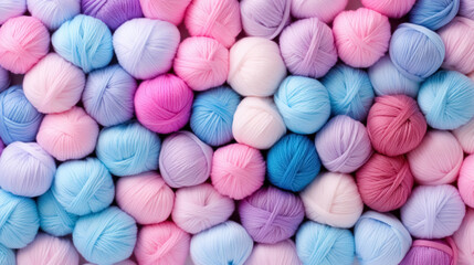 Close-up pattern from lot of colorful round balls of yarn background, collection of rainbow light pastel colors woolen skeins for knitting thread.