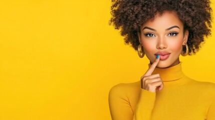 Obraz premium A woman with curly hair poses playfully against a bright yellow background.
