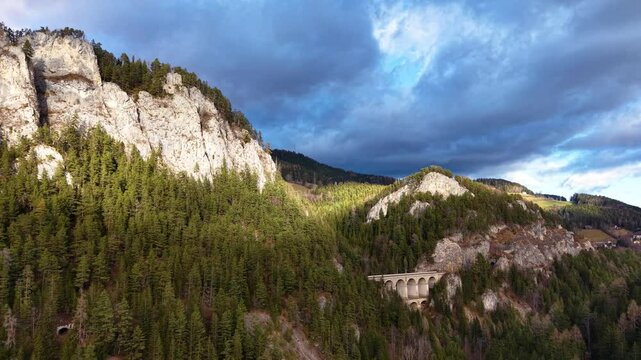 Drone footage of the Semmering railway in early December landscape, Austria, Europe. The landscape on former 20 schilling note bill.