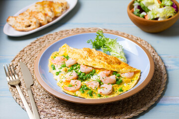 Prawn omelette with peas. Eggs with shrimps
