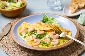 Prawn omelette with peas. Eggs with shrimps