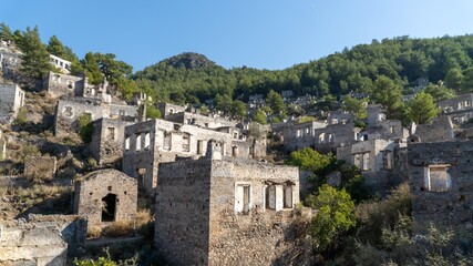 Kayakoy ghost town near Fethiye, Mugla, Turkey. Abandoned Greek village with crumbling stone houses, historic ruins, and a hauntingly beautiful hillside setting.