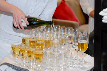 Pouring champagne.