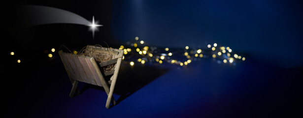 Naklejka premium Nativity Scene. A serene nativity scene with a star and fairy lights