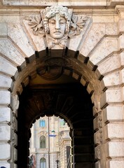 Fototapeta premium ornate stone archway with carved face in budapest