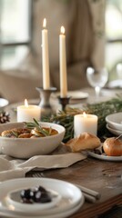 Elegant dinner table set for a festive gathering with candles and delicious food in a cozy indoor setting