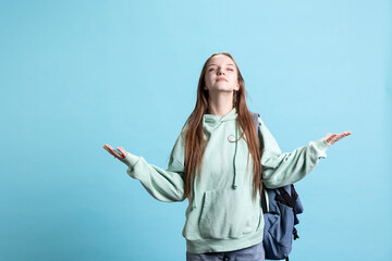 Pious woman looking up towards sky, waiting for sign from god. Spiritual girl doing worship hand...
