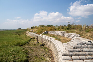 Sea wall  made of sandbags on Two Tree Island, Essex, England, United Kingdom