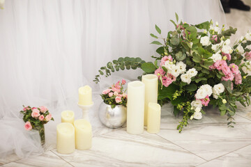 Beautiful candles and flowers on floor at wedding. Flower and candle decoration, Wedding decoration.