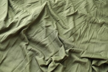 Background texture of camouflage khaki green color military uniform fabric