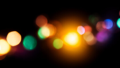 Abstract blurred colorful lens flare bokeh on black isolated background for overlay blending