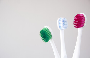 Close-up of plastic toothbrushes with colored bristles