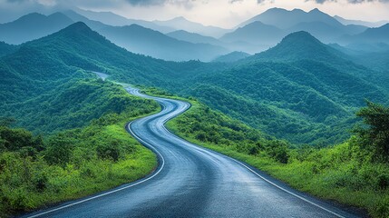 Fototapeta premium Winding Road Through Lush Green Mountains