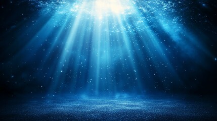 Bright blue light rays shining down on dark, textured surface.