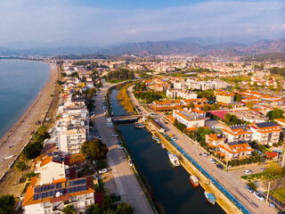 Obraz premium Scenic aerial view of modern cityscape of Fethiye along shoreline of Aegean Sea on sunny winter day, Turkey