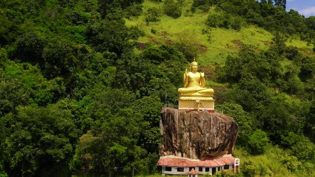 Aerial view of Buddha statue, Seated Buddha on rock, Aluvihara Rock Temple, Matale, Central Province, Sri Lanka, Asia.