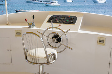 Serene maritime scene with boat helm and ocean view