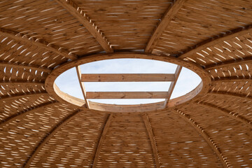 Intricate wooden dome ceiling with sky view - architectural art and design © jockermax3d