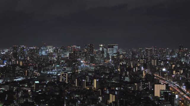 osaka city skyline  establishing aerial shot at night,view of umeda downtown ward from distance