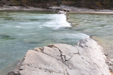 running water over the rock in the river