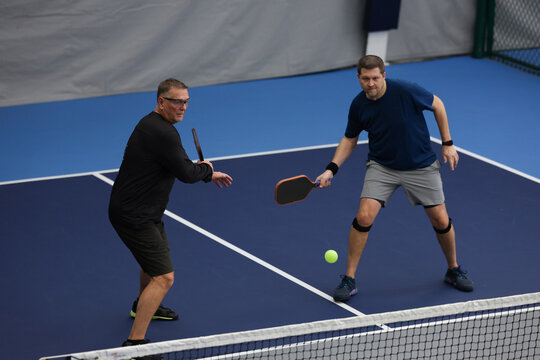 Pickleball doubles played indoors