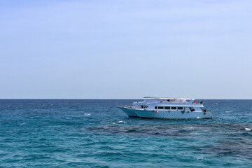 Tranquil ocean scene with sailboat in open sea as summer vacation inspiration