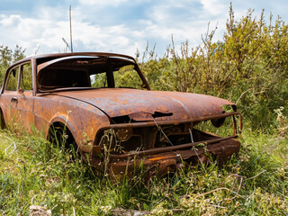 old abandoned car in the forest