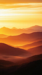 Misty mountains bathed in warm orange and yellow hues at sunset, symbolizing tranquility and the beauty of nature's chaos, a perfect high-definition phone wallpaper to evoke peace and awe