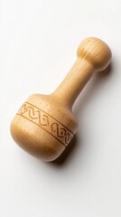 A wooden dreidel featuring Hebrew letters sits alone against a clean white background casting a soft shadow. This represents the festive spirit of Hannukah and offers ample space for text