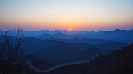 Obraz premium Sunrise Over Great Wall of China Surrounded by Majestic Mountains