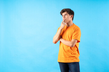 Young person expressing various emotions and body pains, pointing, using a cellphone, with colored...