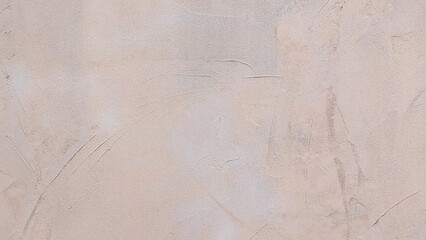 Light salmon rough cement or plaster wall texture or background. Modern peach wall with shovel textured effect.