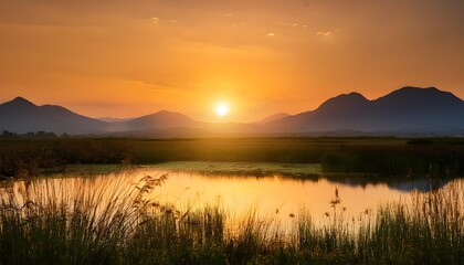 Sunrise over a serene wetland with mountain backdrop. World Wetlands Day