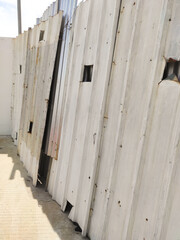 Blockade wall in a building construction project. Zinc walls are installed around the construction...