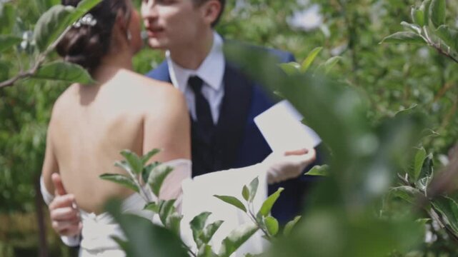 Groom kisses crying bride after reading love letters