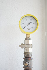 An Industrial Pressure Gauge Installed on a Pipe System for Monitoring