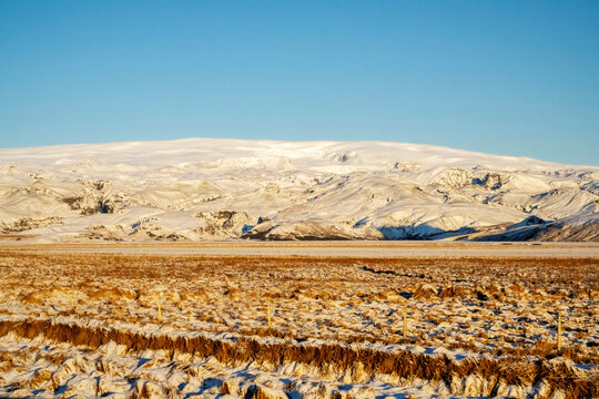 Panoramic view of snow capped mountain landscapes with blue sky background
