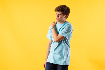 Young person expressing various emotions and body pains, pointing, using a cellphone, with colored...