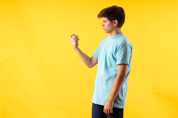 Young person expressing various emotions and body pains, pointing, using a cellphone, with colored...