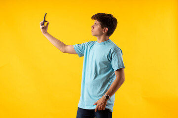 Young person expressing various emotions and body pains, pointing, using a cellphone, with colored...