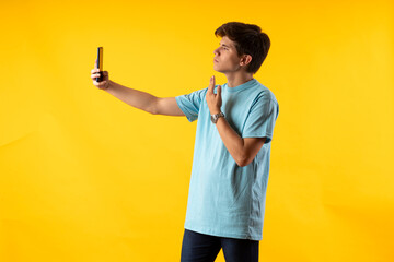 Young person expressing various emotions and body pains, pointing, using a cellphone, with colored...