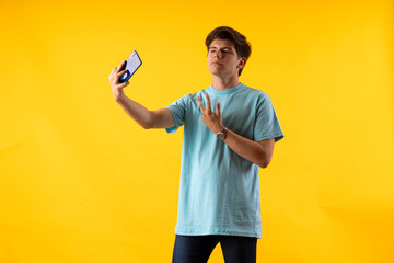 Young person expressing various emotions and body pains, pointing, using a cellphone, with colored...