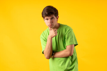 Young person expressing various emotions and body pains, pointing, using a cellphone, with colored...