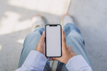 Male hands holding smartphone with blank screen. Technology or mobile device apps dependence