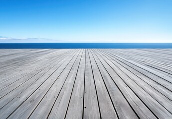 Expansive Coastal View with Wooden Deck Overlooking Calm Sea and Clear Blue Sky on a Sunny Day, Ideal for Relaxation and Serenity