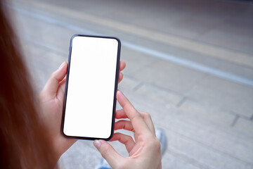 Hand holding smartphone mockup of blank screen, Take your screen to put on advertising.