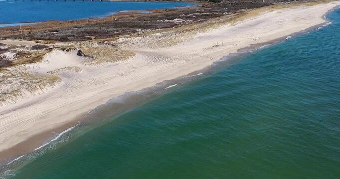 Southampton, NY, USA - 11-20-2024:  Late morning aerial, drone, video of Panquogue Beach on a sunny fall day.  30 FPS