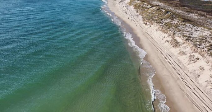 Southampton, NY, USA - 11-20-2024:  Late morning aerial, drone, video of Panquogue Beach on a sunny fall day.  30 FPS